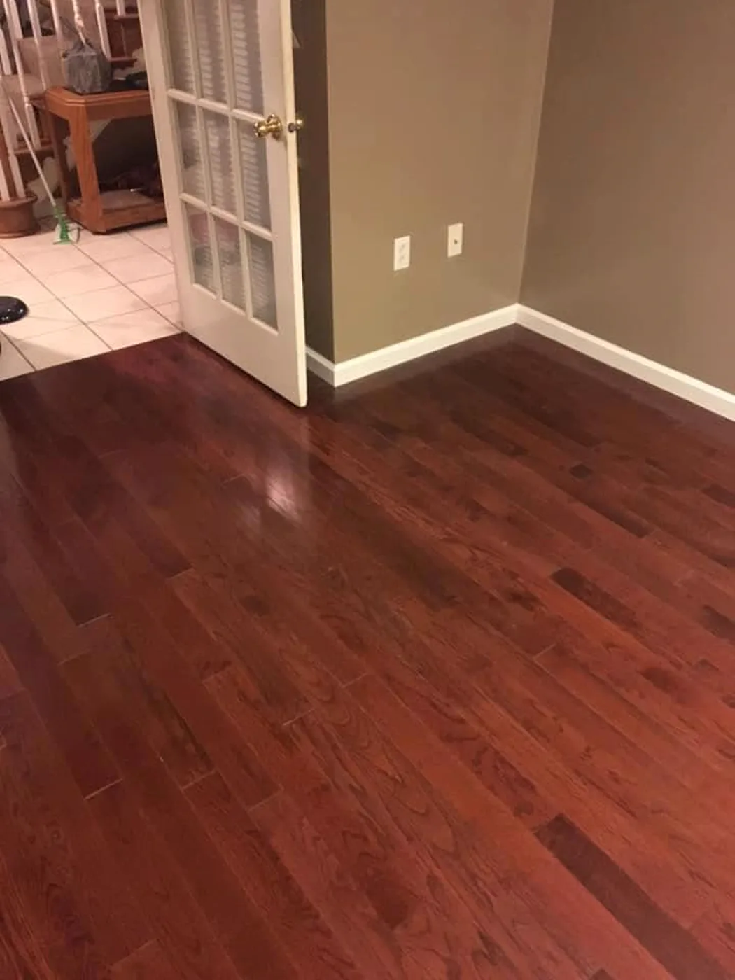 Cherry-stained hardwood flooring installed